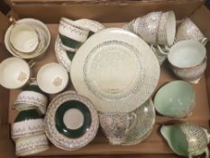 A collection of green & gilt decorated tea ware