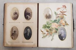 A Victorian leather bound photo album (front cover detached but present).