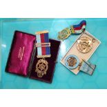 An interesting group of masonic medals, 3 hallmarked silver examples and a 9ct rose gold example (