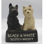 Black & White Scotch Whisky ceramic advertising figure.