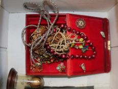 A collection of vintage costume jewellery including necklaces, beads, brooches etc.