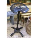 Cast Iron tractor seat type bar stool.