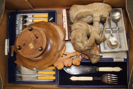 A collection of boxed cutlery items together with carved wooden musical fruit/nut bowl etc (1 tray).
