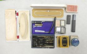 A collection of collectable items including cut throat razor,Geometry boxed set, 2 sets of pearls,