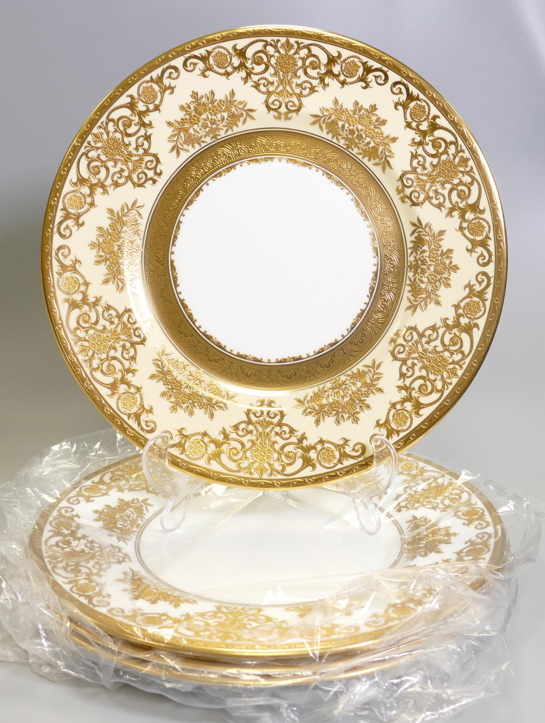 De Lamerie Fine Bone China heavily gilded Exotic Garden patterned Dinner plates in a Cream on