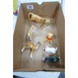 A collection of Beswick & Goebel figures to include Lion Cub, Kid Goat, damaged Winnie the Pooh
