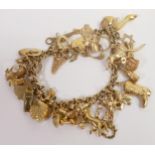 9ct gold charm bracelet with approx 32 9ct gold charms, 30.9g.