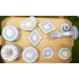 A collection of Wedgwood Jasperware to include lidded boxes, pin trays, candlesticks etc