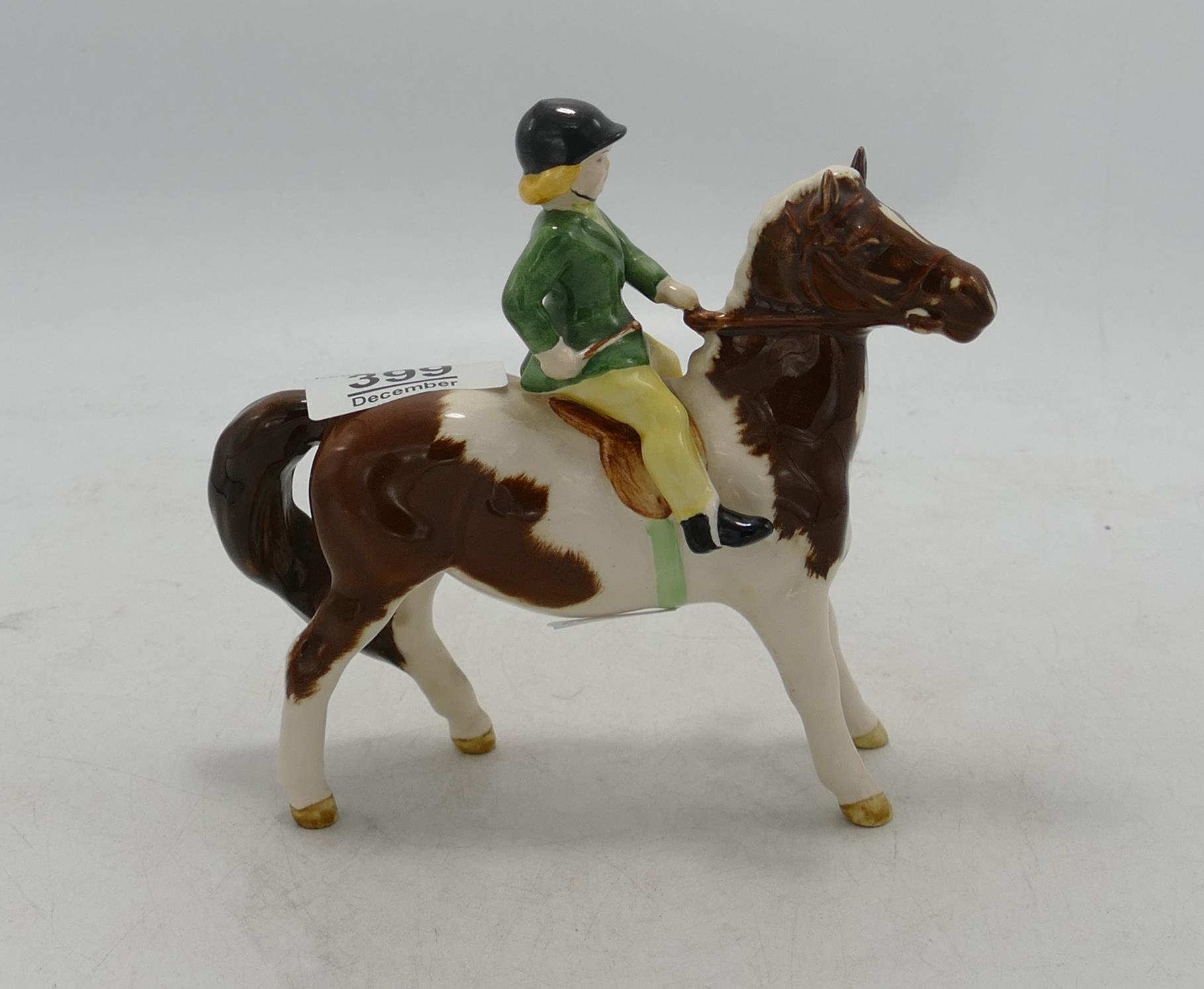 Beswick girl on skewbald pony 1499