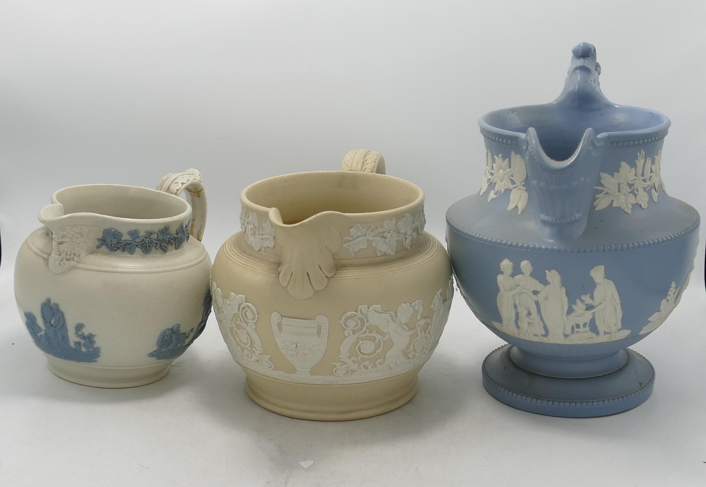 Three 19th Century Large Relief Decorated jugs, height of tallest 22.5cm(3)