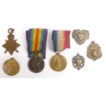 A collection of first world war medals and 2 silver shield medals etc (7)