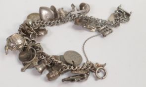 Silver charm bracelet, 63.7g.