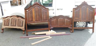 Two South African Hard Wood Carved Single Beds on ball & Claw Feet, with fittings, irons and slats(