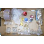 A collection of glassware to include paperweights, crystal bottles, decorated cheese dish etc