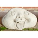 Stone garden ornament of happy face stones