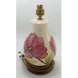 Moorcroft magnolia on cream lamp base. Height including fitting 28cm