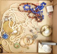 A collection of vintage ladies costume jewellery including gold plated bracelets,necklaces, stamps
