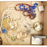 A collection of vintage ladies costume jewellery including gold plated bracelets,necklaces, stamps