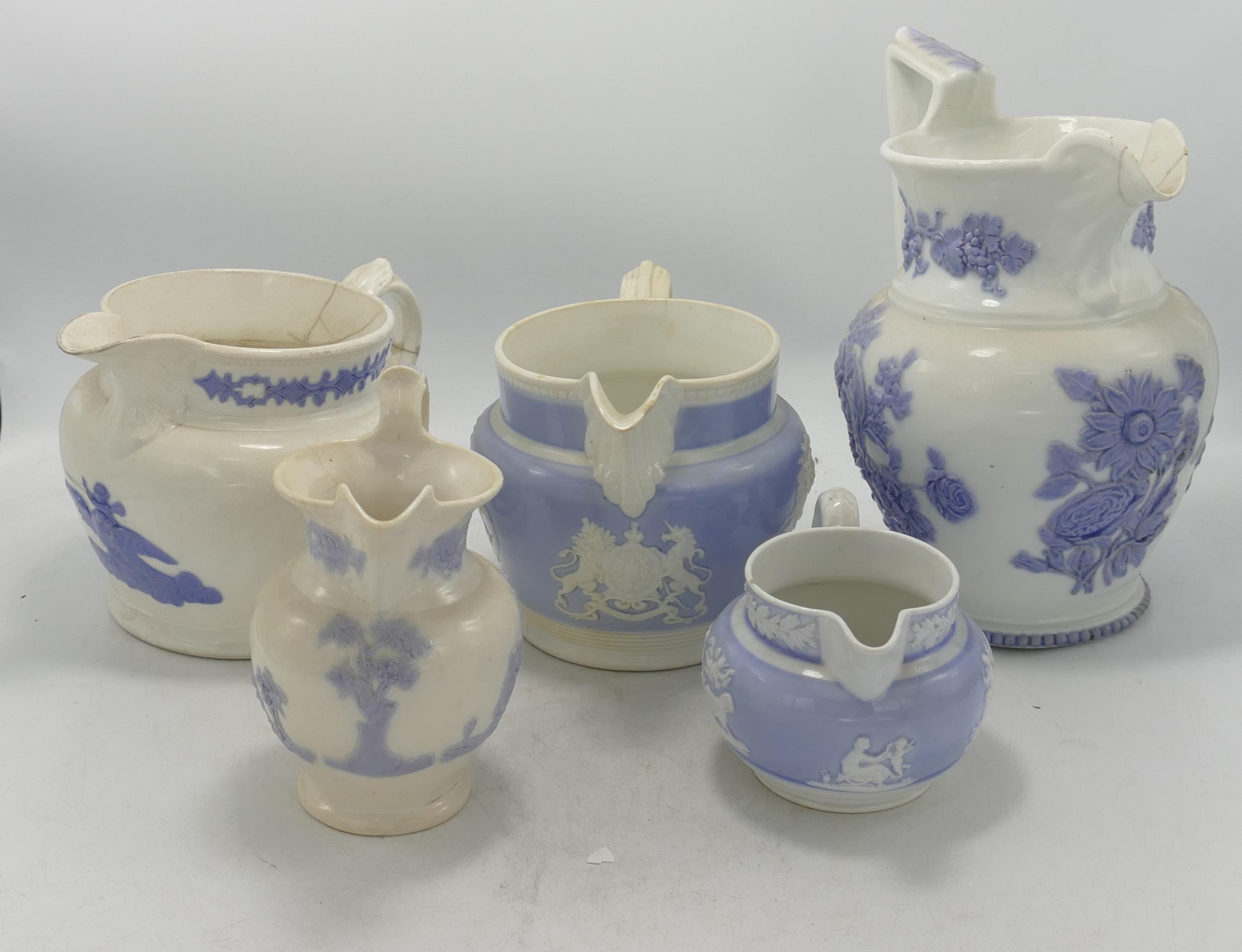 A collection of 19th Century Large Relief Decorated jugs, height of tallest 22.5cm(all with