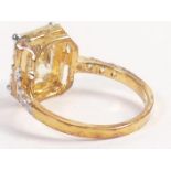 Tru Diamonds emerald cut light yellow stone & white stone cluster ring, size R, with unknown gilt