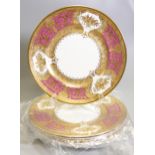 De Lamerie Fine Bone China heavily gilded Royale patterned Dinner plates in a pink / red colour,