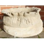 Stone garden ornament of a large sack planter