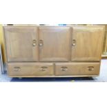 Blonde Ercol three drawer, three door low sideboard height 66.5cm, width 129cm and depth 44cm