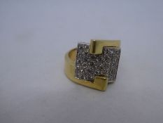 Art Deco design crossover yellow gold crossover design ring with central rectangular panel set appro
