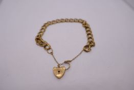 Pretty 9ct yellow gold link bracelet with heart shaped clasp and safety chain, marked 375, 10.4g app