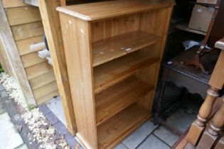 A modern pine open bookcase, carved oak table and sundry