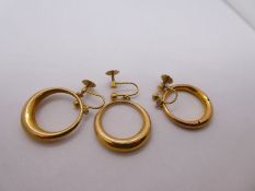 Pair of 9ct yellow gold earrings, with screw on backs, marked 9 Carat, and another similar earring,