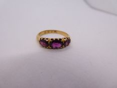 18ct yellow gold dress ring set with three oval faceted graduated Amethyst marked 18, size P, 3.6g a
