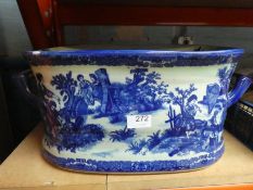 A reproduction blue and white foot bath