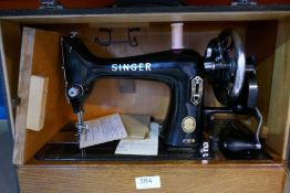 A Frantalini Piano Accordion and a Singer sewing machine