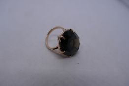 Unmarked yellow gold dress ring with large oval Smokey Topaz, size Q, 10.8g approx