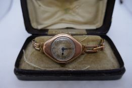 Antique 9ct Rose gold ladies 15 Jewell wristwatch, winds and ticks, on expandable 9ct rose gold stra