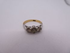 18ct yellow gold diamond trilogy ring, three brilliant cut diamonds, the largest approx 0.40 carat,