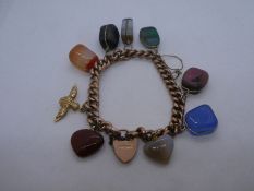 9ct rose gold curb link bracelet hung with 8 various hardstone 'charms' and 9ct RAF charm, with hear
