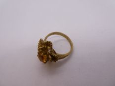 9ct yellow gold dress ring with flower head decoration, set with central citrine, marked 375, 4.6g a