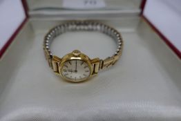 Vintage gold ladies 'Omega' wristwatch with champagne dial, an adjustable strap in Red Omega box