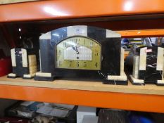 An Art Deco clock garniture, converted to battery