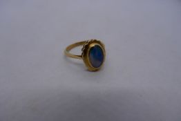 18ct yellow gold dress ring set central unusual blue pearlescent cabouchon stone, marked 18ct, size