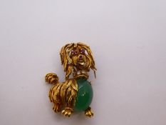 18ct yellow gold brooch in the form of a Scottie dog, with Ruby eyes and nose, diamond collar and po