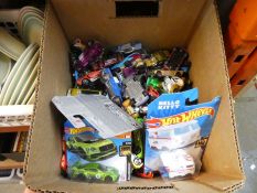 A small carton of Hot Wheels toy cars, and similar