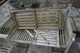 A teak garden bench and sundry