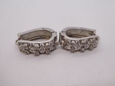 Pair of white metal Art Deco design earrings, set with clear stones, possibly White Sapphires, unmar