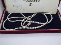 Cased set of double row Pearls, with silver clasp by Mikimoto