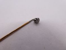 Antique yellow metal stick pin with illusion set diamond head, unmarked in fitted blue leather case