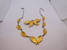 Noweigian Silver necklace forming leaves with yellow enamel detail and matching silver brooch, both