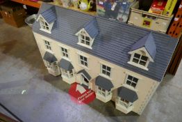 A modern Anglesey Dolls House, Victorian double extended design constructed in 1997, length 120cms